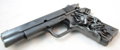 gun with skull on handle gray belt buckle